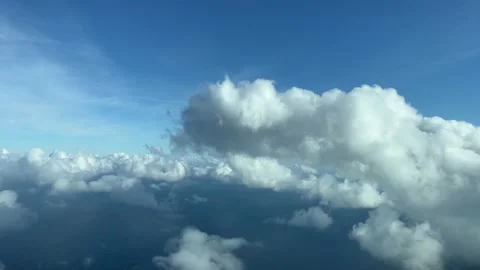 Flying through some tiny cumulus clouds, daylight. Pilot point of view, Stock Footage 234491041