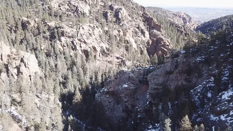 Flying through steep Rocky Mountain granite canyon Video stock 86500925