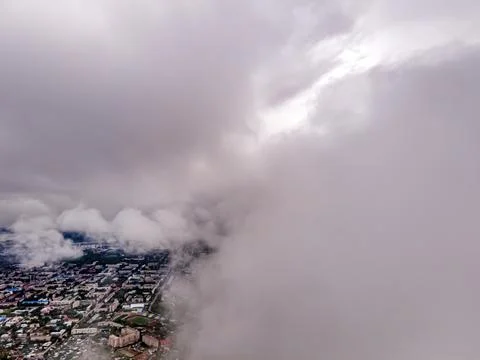 Flying through thick clouds. Rain clouds in the sky. Cumulus clouds, meteorol Stock Photos