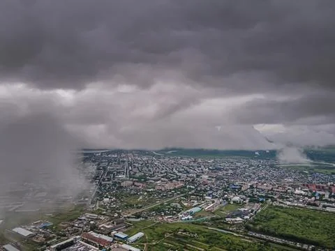 Flying through thick clouds. Rain clouds in the sky. Cumulus clouds, meteorol Stock Photos