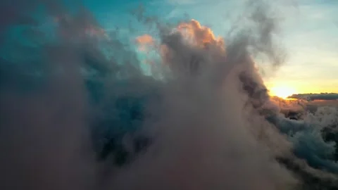 Flying Through Thick Fog And Mist With Hidden Sunset Behind Mountain Range Stock Footage 330762776