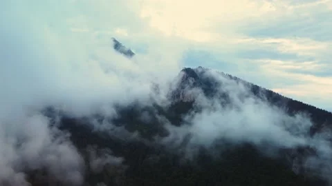 Flying through the thick fog in the mountain landscape after the rain.Aerial Stock-Footage 211814346