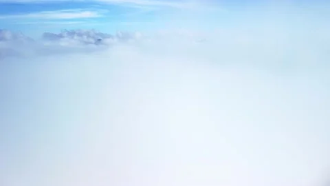 Flying through thick white clouds Stock Footage 221788972