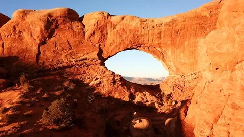 Flying Through Two Arches at Sunrise 02 4K Drone Stock Footage 92883279