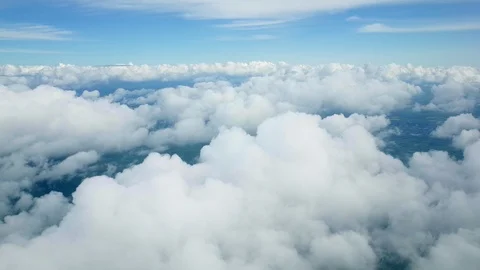 Flying through white fluffy clouds Stock Footage 96690890