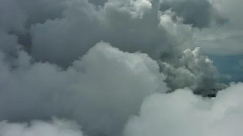 Flying through white fluffy clouds Stock-Footage 249993888