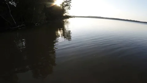 Flying at the time of sunset Lake. Video stock 97973520