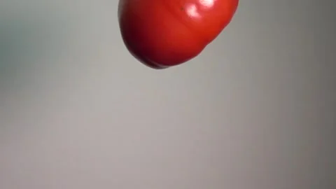 Flying tomato super slow motion Stock Footage 241250818