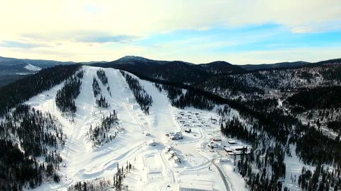 Flying on top of ski resort base Vídeo Stock 109110499