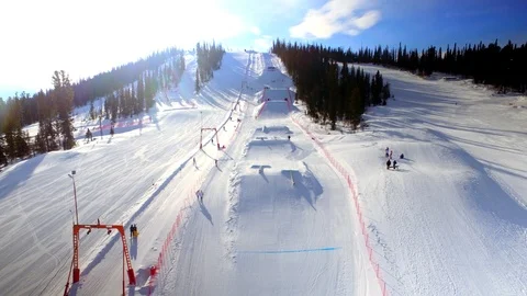 Flying on top of ski resort base Stock Footage 109113415