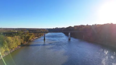 Flying toward a bridge on the Cumberland River in Clarksville,, Tennessee Video stock 324013945