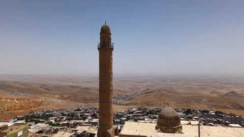 Flying Toward Historic Stone Architecture and Minarets of Mardin Stock Footage 340410366