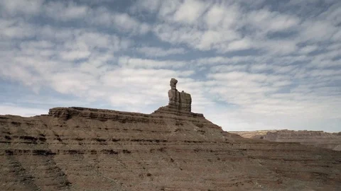Flying up toward huge stone formation in the desert Stock Footage 124866132