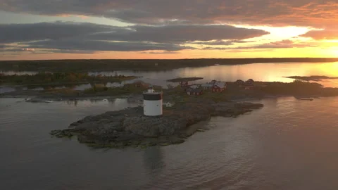 Flying toward an island in the archipelago during a beautiful sunset Stock Footage 133377989