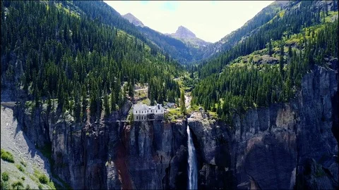 Flying toward mountain waterfall Vídeo Stock 87621648