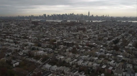 Flying toward New York City skyline over residential area in Jersey City, New Stock Footage 59172235