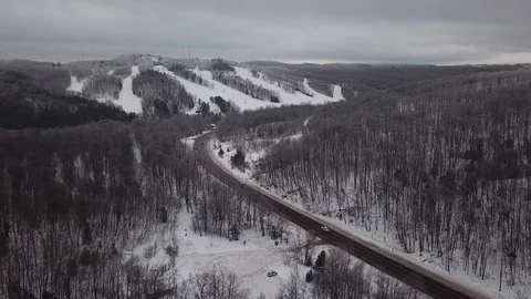Flying toward ski hill Stock Footage 100135830