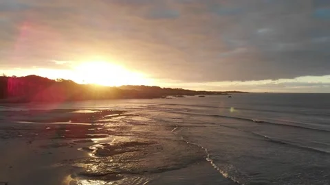 Flying toward the sunset on a beach Stock Footage 151700877
