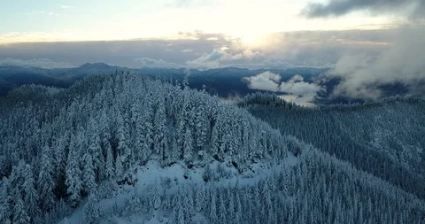 Flying Toward the Sunset Over Snowy Oregon Mountains Stock Footage 112366971