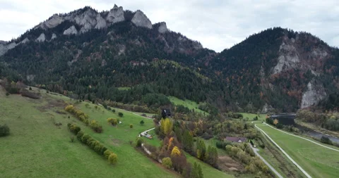 Flying toward Three Crowns peaks in Pieniny on a cloudy autumn day Stock Footage 346644749