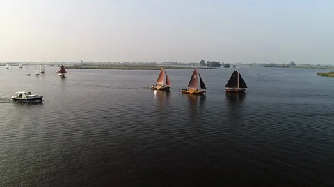 Flying towards 3 old sailing boats - aerial Stock-Footage 103353536