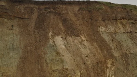 Flying towards and above cliffs to expose town and harbor behind it Video stock 123677371
