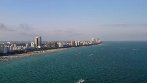 Flying towards the coast from open waters Stock Footage 103329073
