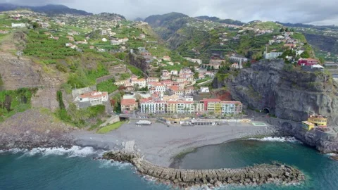 Flying towards colourful beautiful Portuguese village of Ponta do Sol on Madeira Stock Footage 167250853