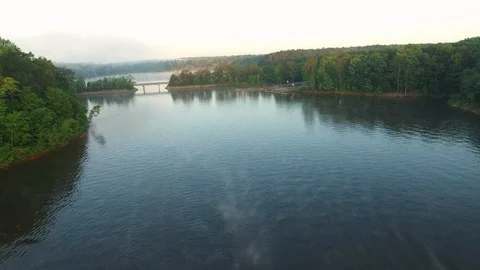 Flying Towards a Dock on a Lake Stockbeeldmateriaal 128523860