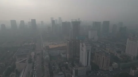 Flying towards downtown Chengdu in central China, smog and air pollution Stock Footage