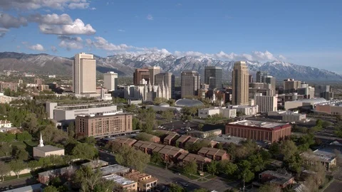 Flying towards downtown Salt Lake City viewing the skyline Stock Footage