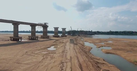 Flying towards to the empty truck driving through a construction site Video stock 75147775