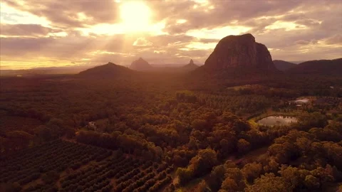 Flying towards the Glass House Mountains at sun set. Stock Footage