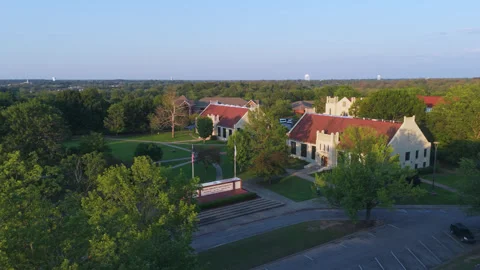 Flying Towards The John Brown University Sign Near The East And West Windgate Stock Footage 331836688