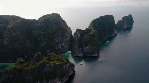 Flying towards limestone cliffs above the ocean, phi phi, Thailand Video stock 89949835