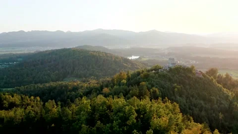 Flying Towards Medium Sized Medieval Castle Called Smlednik Castle in the Sunset Stock Footage 237601734