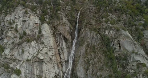 Flying towards middle of waterfall and rising drone 4k footage 動画素材 139847557