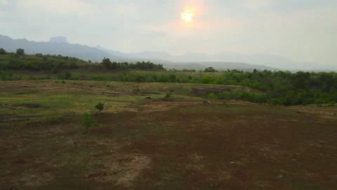 Flying towards the mountains during sunset or aerial view of table landscape Video stock 156485452
