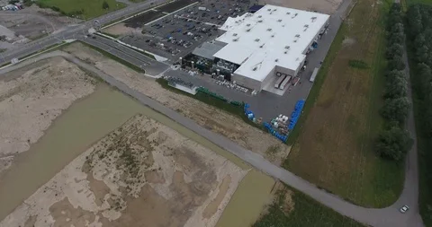 Flying Towards Newly Constructed Big Box Hardware Store With Farmland Aerial Stock Footage 88905552