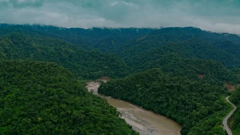 Flying towards Peru's rainforest mountains with river Stock Footage 116396770