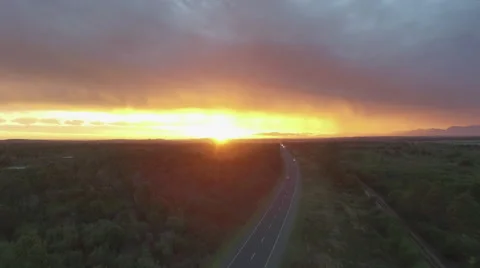 Flying Towards Red Sunset over Train Tracks Stock Footage 65078560