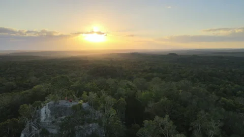 Flying towards the setting sun with La Danta Pyramid, El Mirador 4K Stock Footage 249109521