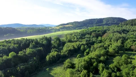 Flying towards spring hills Stock Footage 276540833