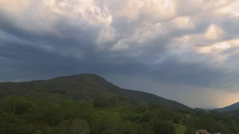 Flying Towards A Stormy Hill 스톡 동영상 267799758