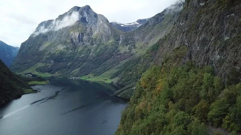 Flying towards a Stream Falling off a Hanging Valley into Nærøyfjord Stock Footage 81494162