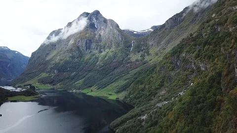 Flying towards a Stream Falling off a Hanging Valley into Nærøyfjord Stock Footage 81494216