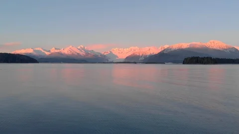 Flying towards sunset mountains over the ocean Stock Footage 100499384