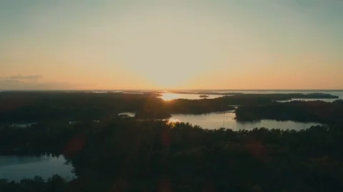 Flying towards the sunset over archipelago. Video stock 114003805