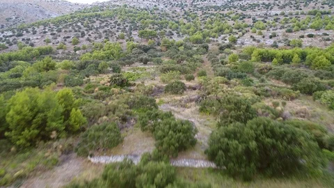 Flying towards a top of a hill Stock Footage 100725283