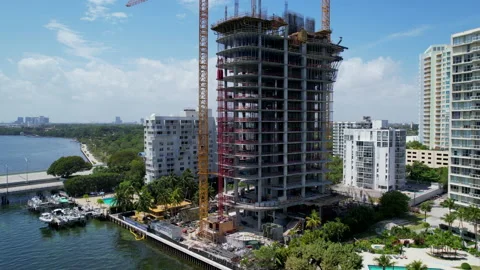 Flying towards tower construction in Miami Stock Footage 239884444